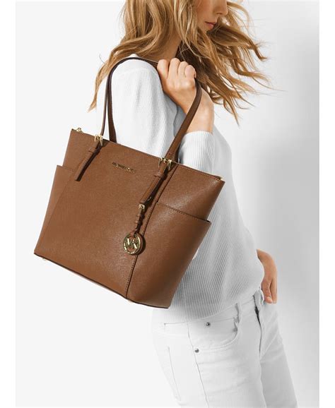 michael kors east west top zip signature tote|Michael Kors large saffiano tote.